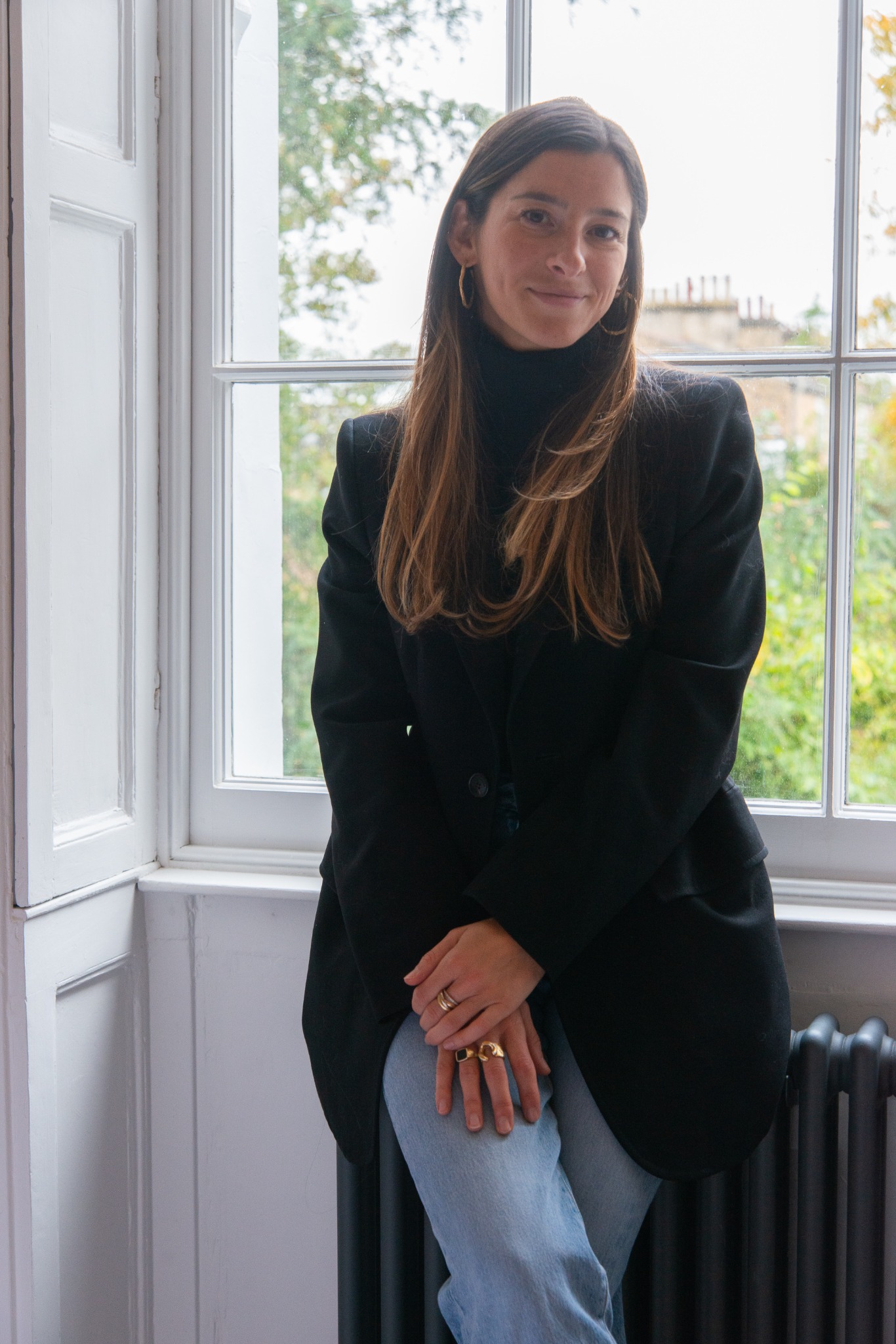 Environmental portrait beside a window