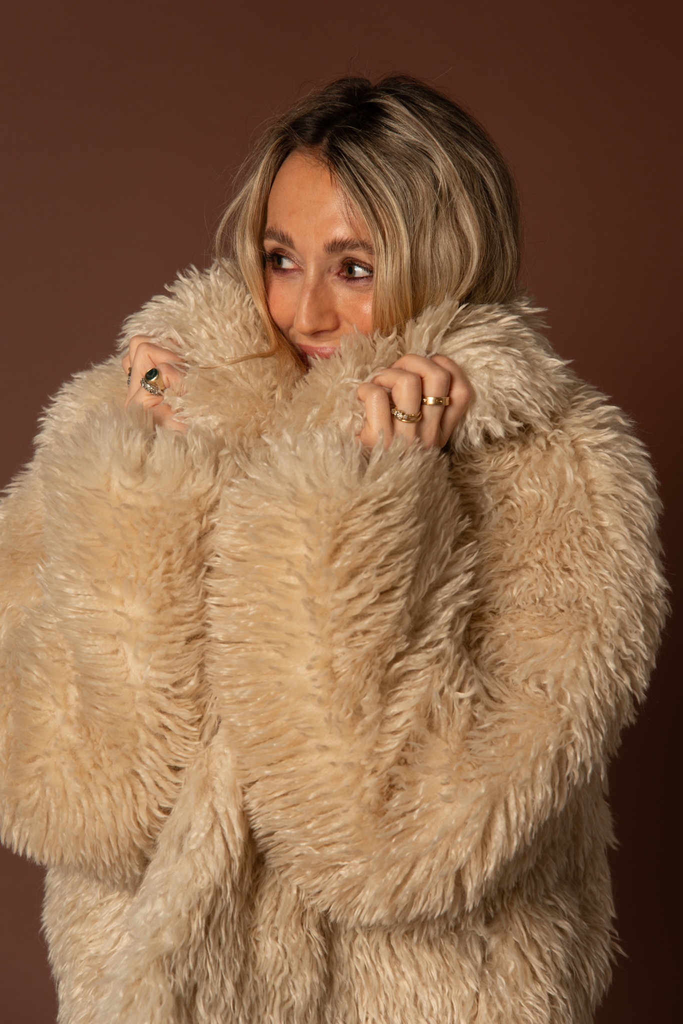 Playful editorial portrait in faux fur