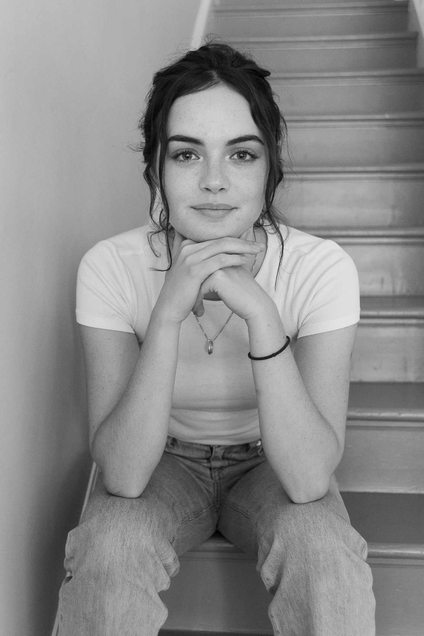 Black and white portrait seated on stairs